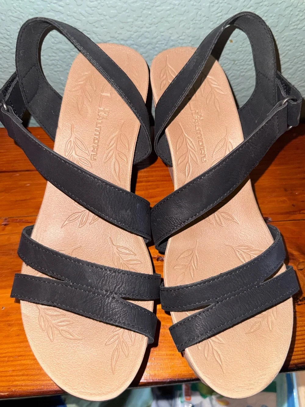 Black and tan CL by Laundry sandals featuring a cross strap and cork style heels